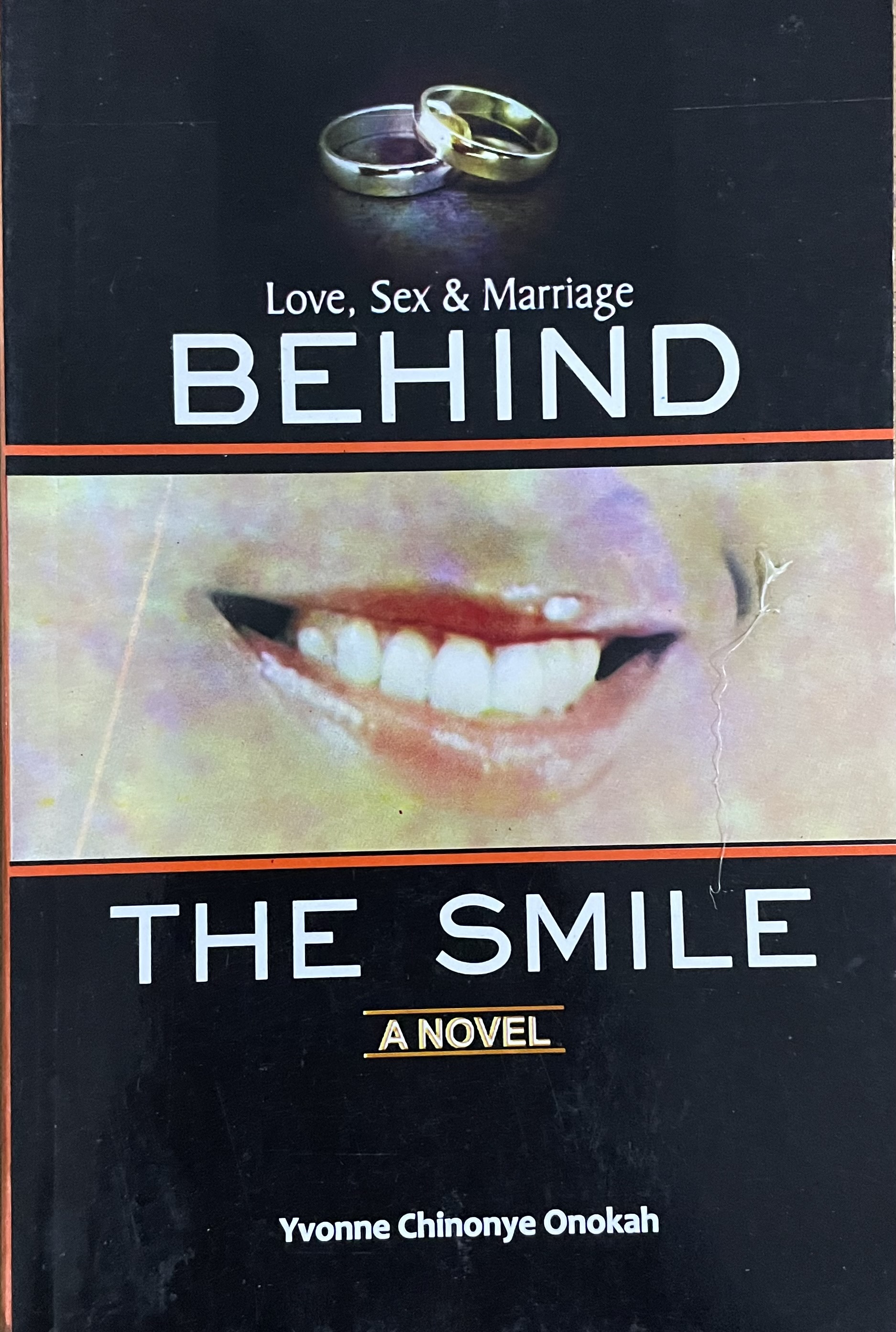 BEHIND THE SMILE